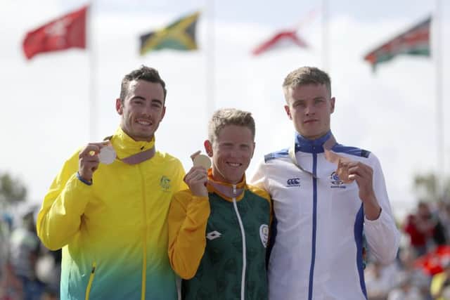 Marc Austin of Scotland, with his bronze medal, alongside Jacob Birtwhistle of Australia and gold medallist Henri Schoeman of South Africa PICTURE: AP