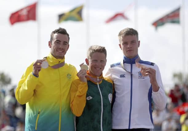 Marc Austin of Scotland, with his bronze medal, alongside  Jacob Birtwhistle of Australia and gold medallist Henri Schoeman of South Africa PICTURE: AP