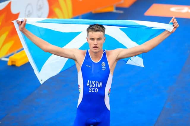 Austin flies the flag after his shock bronze PICTURE: PA