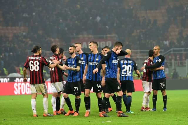 Milan and Internazionale players shake hands at the end of the Milan derby. Picture: AFP/Getty Images