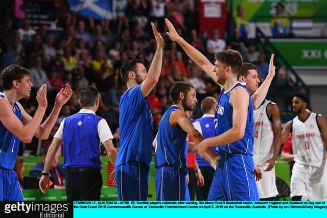 Scotland's jubilant basketball team celebrate their famous win over England. PICTURE: Getty Images
