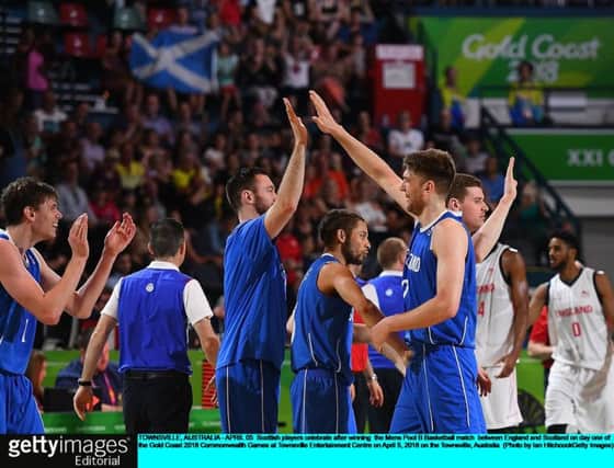 Scotland's jubilant basketball team celebrate their famous win over England. PICTURE: Getty Images