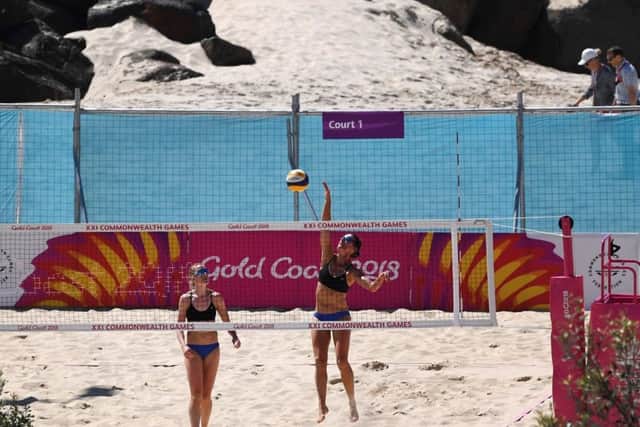 TOPSHOT - Scotland's Lynne Beattie (L) and Melissa Coutts (R) practice ahead of their preliminary women's beach volleyball match against Grenada PICTURE: Getty Images