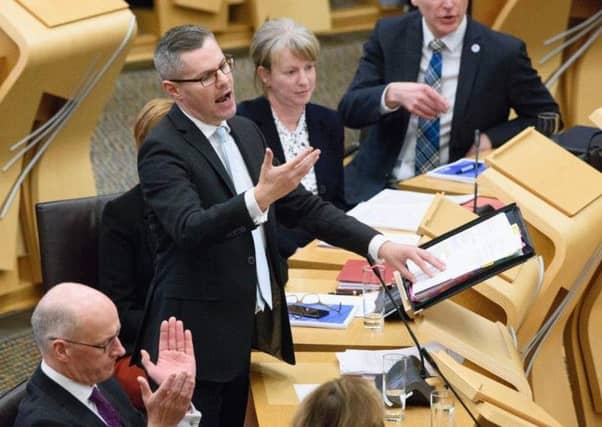 Derek Mackay delivers his Scottish budget. Picture: PA