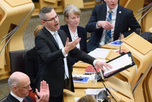 Derek Mackay delivers his Scottish budget. Picture: PA