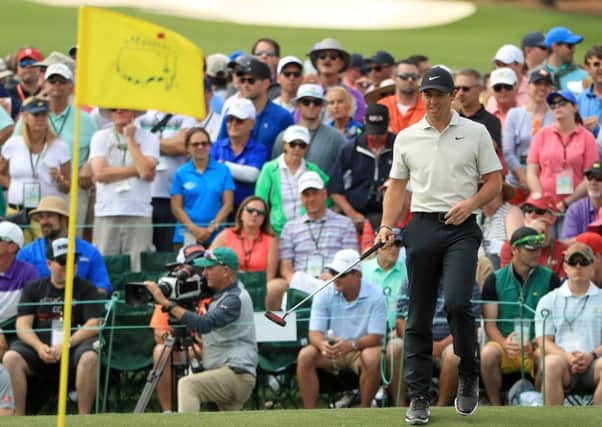 Rory McIlroy reacts to a putt on the 18th green during his round of 71. Picture: Getty Images