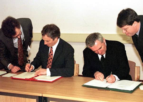 Tony Blair and Irish Taoiseach Bertie Ahern signing The Northern Ireland Peace Agreement on 10 April, 1998. Picture: John Giles/PA