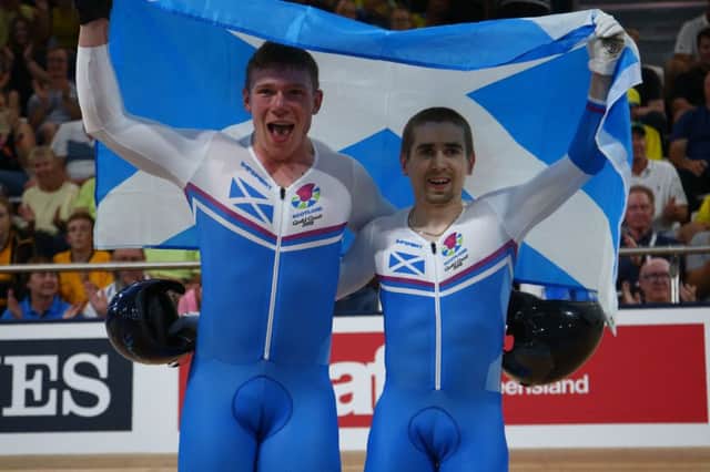 Scotland's Neil Fachie, right, and pilot Matt Rotherham celebrate their gold. PICTURE: Getty