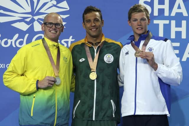 Duncan Scott, far right, shows off his 200m butterfly bronze medal alongside champion Chad le Clos, centre, and Australia's David Morgan. PICTURE: AP