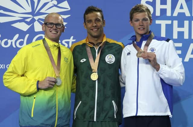 Duncan Scott, far right, shows off his 200m butterfly bronze medal alongside champion Chad le Clos, centre, and Australia's David Morgan. PICTURE: AP