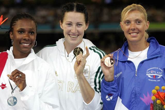 Scotland's Lee McConnell, right, after winning bronze in the 400m hurdles at the 2006 Commonwealth Games. Autralian Jana Pittman, centre, and Natasha Danvers-Smith of England, left, won gold and silver. Picture: AFP/Getty Images