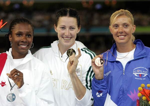 Scotland's Lee McConnell, right, after winning bronze in the 400m hurdles at the 2006 Commonwealth Games. Autralian Jana Pittman, centre, and Natasha Danvers-Smith of England, left, won gold and silver. Picture: AFP/Getty Images