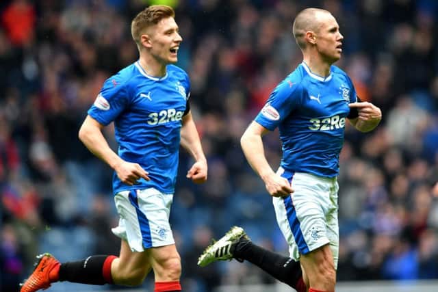 Kenny Miller celebrates his opener with Greg Docherty. Picture: SNS/Bill Murray