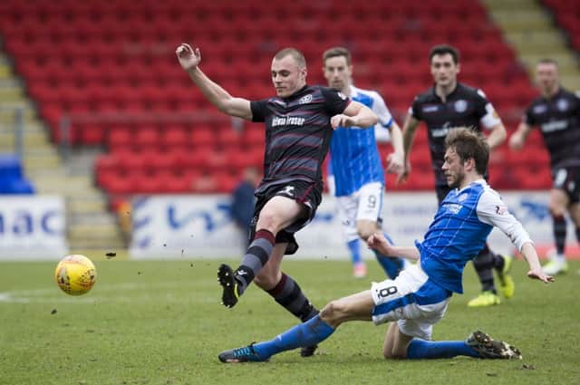 St Johnstone's Murray Davidson challenges Liam Grimshaw. Picture: SNS/Kenny Smith