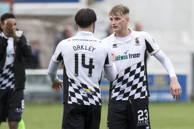 Inverness players George Oakley and Coll Donaldson celebrate at full time. Picture: SNS/Bruce White