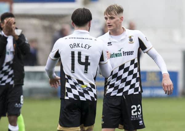 Inverness players George Oakley and Coll Donaldson celebrate at full time. Picture: SNS/Bruce White