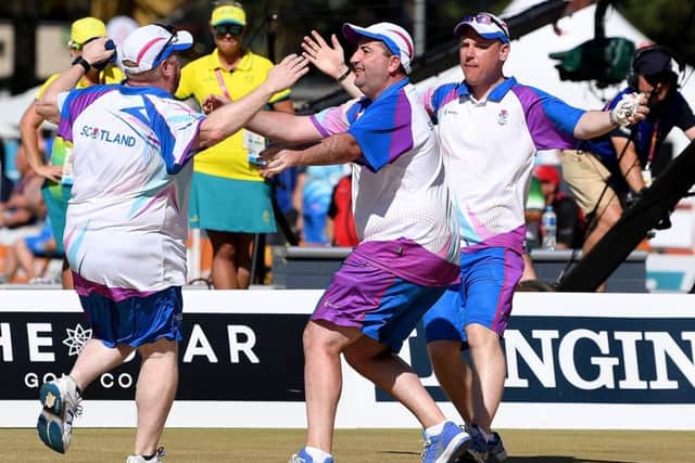 Ronald Duncan, Darren Burnett and Derek Oliver of Scotland celebrate winning the Men's Lawn Bowls Triples Getty Images