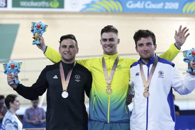 Callum Skinner right, with time trial silver medallist Edward Dawkins from New Zealand and gold medalist Matt Glaetzer from Australia PICTURE: AP