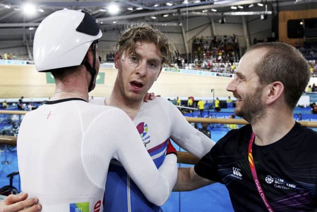 An exhausted Mark Stewart celebrates his gold with the team PICTURE: AP