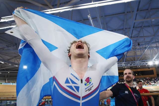 Mark Stewart celebrates winning the gold medal in the Men's 40km Points Race Final track cycling. Picture: Dean Mouhtaropoulos/Getty Images