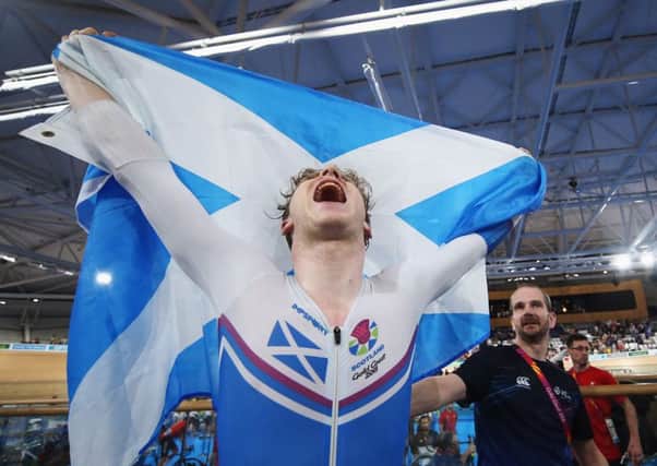 Mark Stewart celebrates winning the gold medal in the Men's 40km Points Race Final track cycling. Picture: Dean Mouhtaropoulos/Getty Images