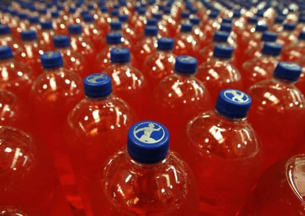 The Glasgow dad is auctioning off five cases of the fizzy drink. Picture: Andrew Milligan/PA Wire