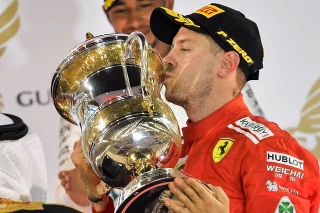 Sebastian Vettel kisses the trophy after continuing his impressive start to the season. Picture: AFP/Getty