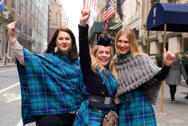 Louise Mitchell (centre) wearing the fair trade tartan with friends in New York at the Tartan Day Parade. Picture: Martin McAdam