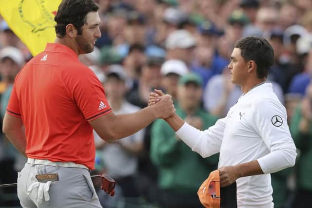 Runner-up Rickie Fowler, right, shakes hands with Jon Rahm after playing the last. Picture; AP