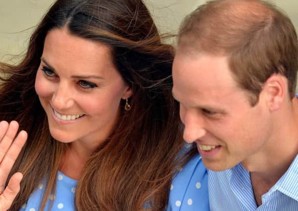 Duke and Duchess of Cambridge with their son Prince George of Cambridge in 2013. Picture: PA Wire