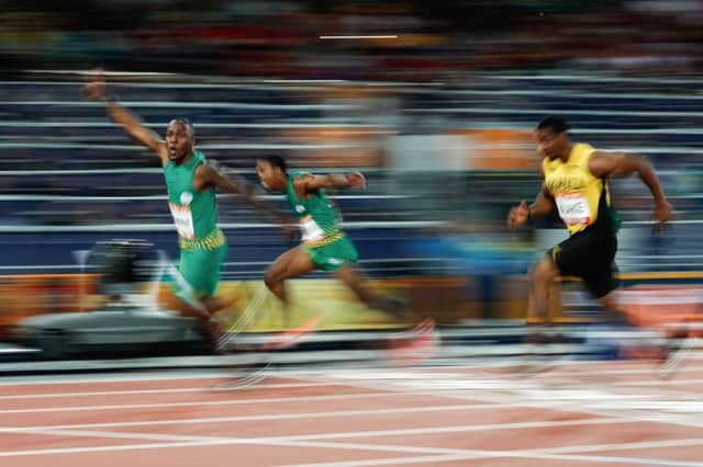 South Africa's Akani Simbine celebrates as he wins the gold medal ahead of countryman Henricho Bruintjies and Jamaica's Yohan Blake PICTURE: Getty Images