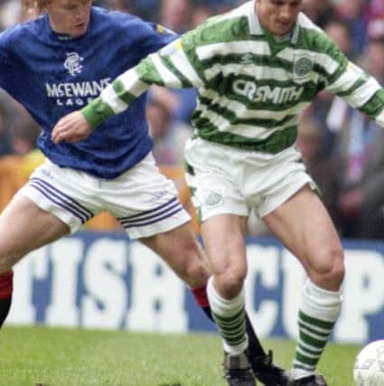 McCall in action against Andreas Thom of Celtic in an Old Firm match in April 1996. Picture: SNS Group