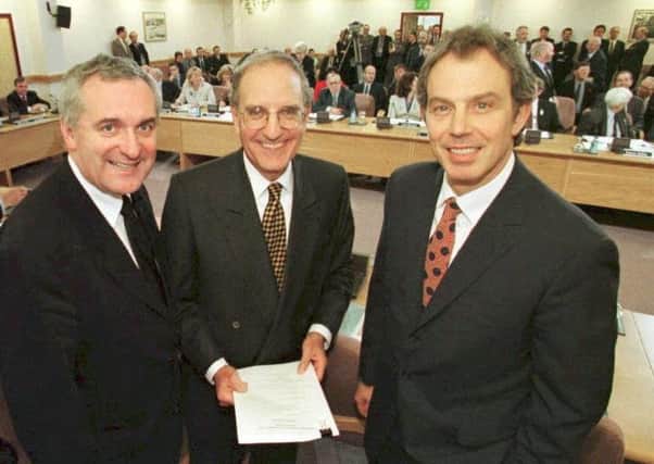 There were smiles all round in 1998, when the then Prime Minister Tony Blair, US Senator George Mitchell (centre) and Irish Prime Minister Bertie Ahern signed the Good Friday Agreement. (Picture: AFP/Getty)