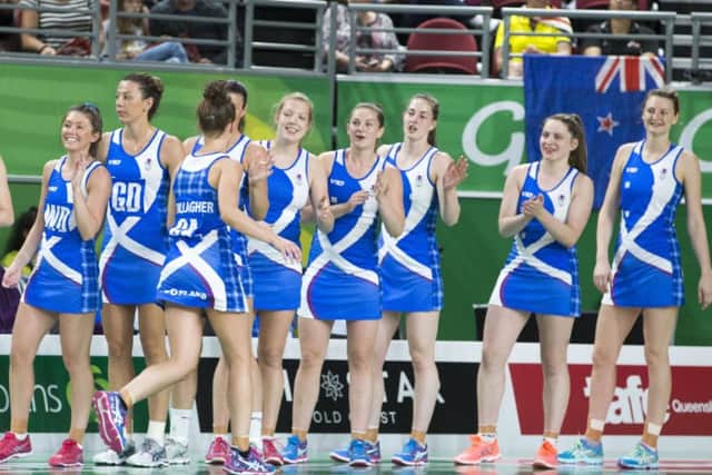 Scotland's netballers keep their spirits up during a heavy loss to superpowers New Zealand PICTURE: PA