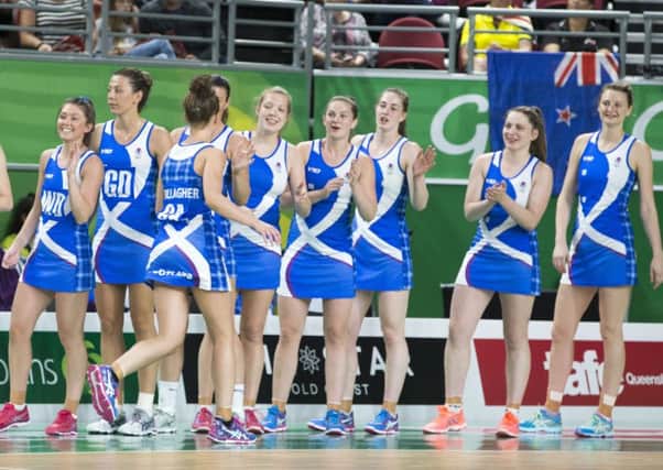 Scotland's netballers keep their spirits up during a heavy loss to superpowers New Zealand PICTURE: PA