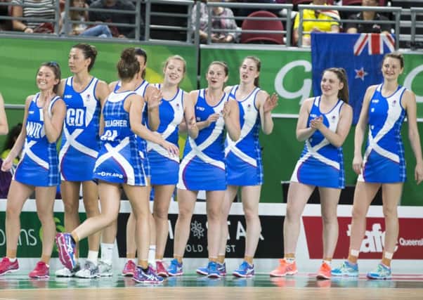 Scotland's netballers keep their spirits up during a heavy loss to superpowers New Zealand PICTURE: PA