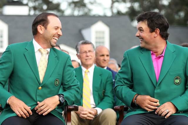 Patrick Reed, right, laughs with Sergio Garcia after being presented with the green jacket in honour of winning the 2018 Masters at Augusta. Picture: Patrick Smith/Getty Images