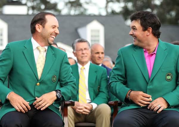 Patrick Reed, right, laughs with Sergio Garcia after being presented with the green jacket in honour of winning the 2018 Masters at Augusta.  Picture: Patrick Smith/Getty Images
