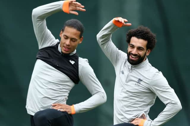 Liverpool's Virgil van Dijk and Mohamed Salah warm up before a training session. Picture: Jan Kruger/Getty Images