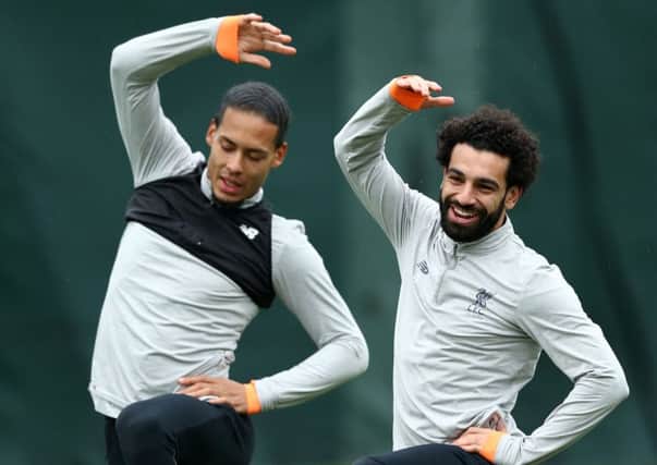 Liverpool's Virgil van Dijk and  Mohamed Salah warm up before a training session. Picture: Jan Kruger/Getty Images