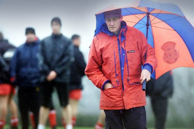 Lambie braves the elements at Ruchill Park, Glasgow, as his Partick players are put through their paces in February 2002. Picture: Donald MacLeod