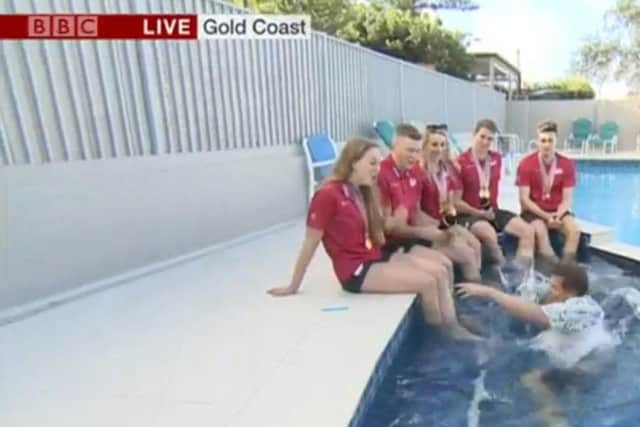 Bushell takes a tumble while interviewing Team England's swimmers. Picture: BBC Breakfast / PA