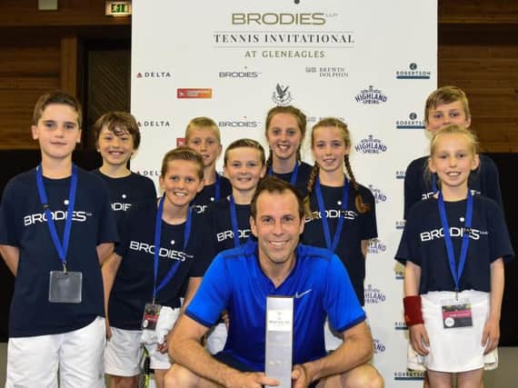 Brodies supports the Scottish Schools Championships and the Brodies Tennis Invitational, which last year was won by Greg Rusedski, pictured with prize