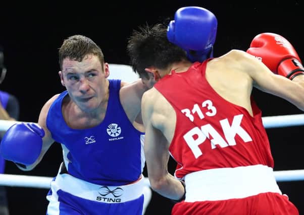 Reece McFadden lands a blow on his Pakistani opponent. PICTURE: Getty Images