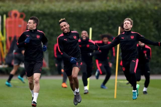 Arsenal players, from left, Laurent Koscielny, Pierre-Emerick Aubameyang and Nacho Monreal train before their Europa League quarter-final second leg against CSKA Moscow. Picture: PA.