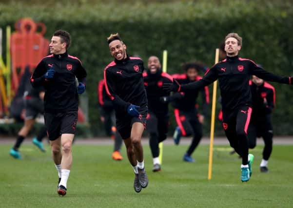 Arsenal players, from left, Laurent Koscielny, Pierre-Emerick Aubameyang and Nacho Monreal train before their Europa League quarter-final second leg against CSKA Moscow. Picture: PA.
