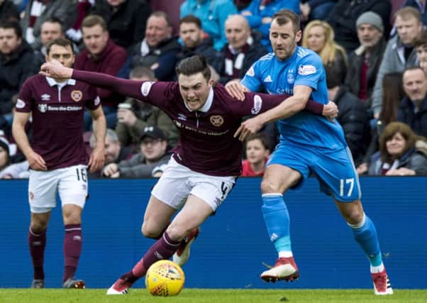 Hearts' John Souttar holds off Aberdeen's Niall McGinn at Tynecastle, which will only host two more games this season. Picture: Alan Harvey/SNS
