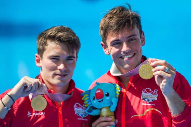 Tom Daley, right, and Dan Goodfellow with their synchronised diving golds. Picture: AP