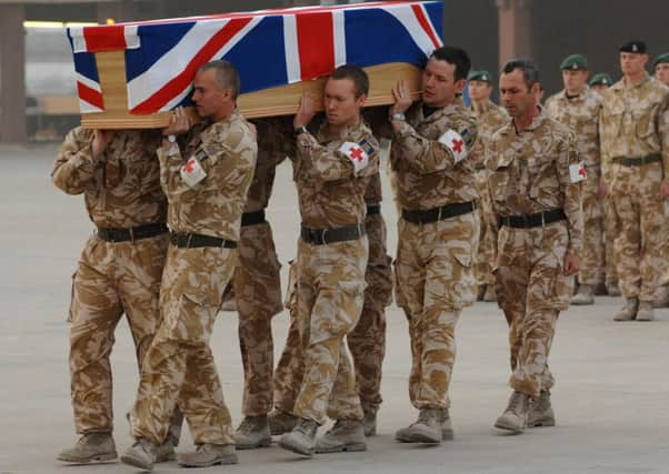 The coffin of Corporal Kris O'Neill is carried by friends and colleagues at the sunset repatriation ceremony at Basra, Iraq. Picture: Crown Copyright/Getty Images)