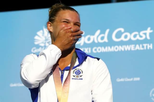 Grace Reid shows her emotion on the podium after receiving her gold medal. PICTURE: Getty Images